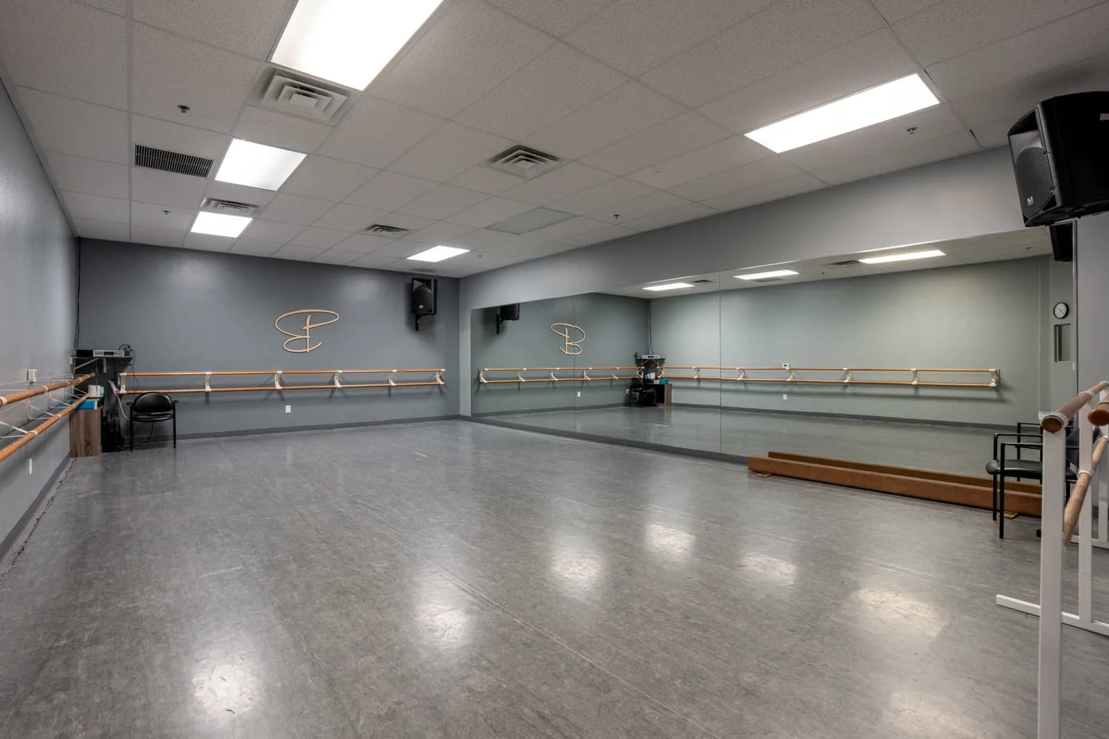 Ballet studio at Evolve Dance Center with full mirror wall and barres