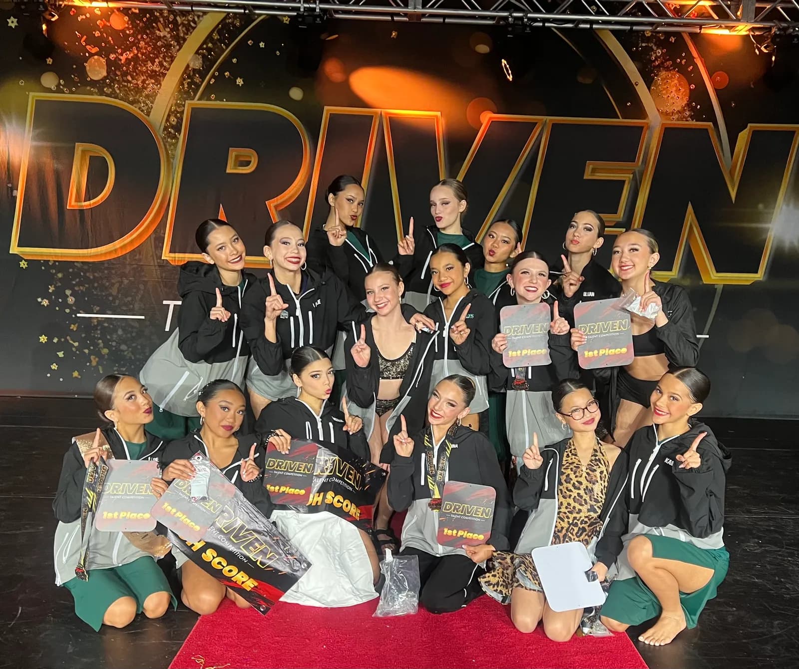Evolve Dance Project team celebrating a first-place win at Driven Talent Competition
